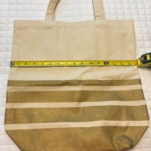 Paper Source canvas tote bag with gold design.